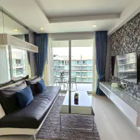 Spacious 1BR Furnished Pool-View Condo at Apus, Central Pattaya — Large Balcony & Resort Pool thumbnail