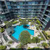 Spacious 1BR Furnished Pool-View Condo at Apus, Central Pattaya — Large Balcony & Resort Pool thumbnail